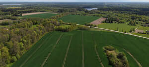 countryside with forests lake and fields seen from above