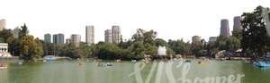 pond with a big city in the background