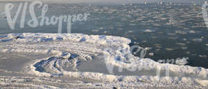 partially frozen and snowy sea surface