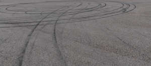 asphalt field with tyre tracks