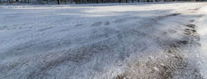 snowy road with shadows