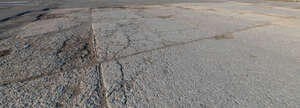 field of worn out tarmac plates