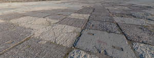 field of old tarmac in evening light