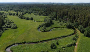 aerial view of a countryside with river and forests