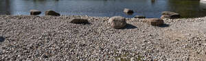 rocky bank of a pond