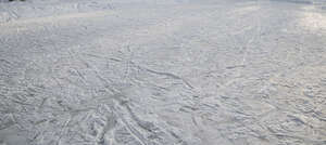 frozen lake surface with skating tracks