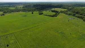 aerial view of a countryside with green fields