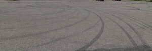 asphalt field with tyre tracks