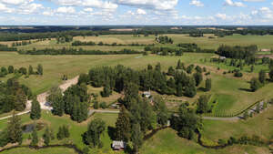 aerial view of a countryside with houses and roads