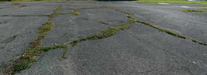 patchy crumbling asphalt