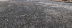 field of dark asphalt gravel