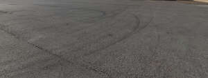 square covered with dark tarmac