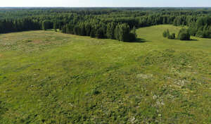 aerial view of a rural landscape with a large grassland