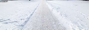 footpath in winter covered with snow