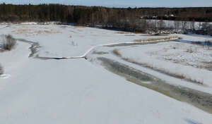 aerial view of a riverbank in winter