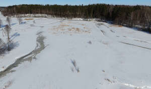 wild riverbank in winter seen from above