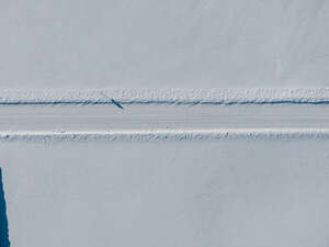 top aerial view of a snowy road