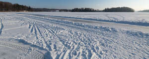 snow covered lake with skating track