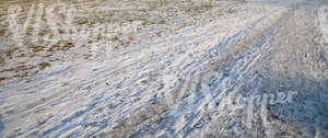 snow-covered ground with a pathway