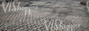 paved square with tree shadows