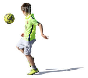 young boy playing with a ball