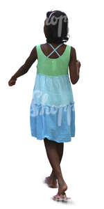 young black girl in a summer dress walking