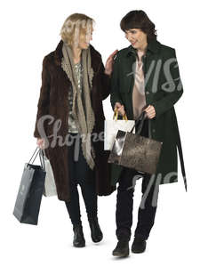 two women with shopping bags walking and talking