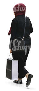 muslim woman carrying a big shopping bag