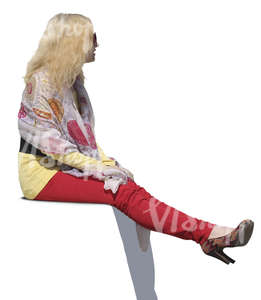 woman with blond hair sitting 