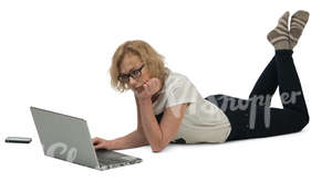 woman lying on the floor and working with her laptop