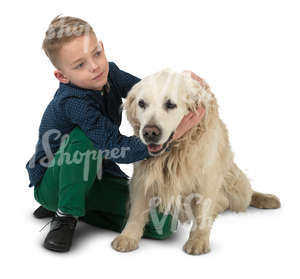 young boy sitting on the floor with his dog