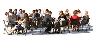 street cafe scene with many groups of people sitting and talking