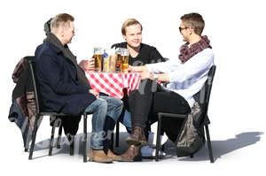 four young men sitting in a cafe and drinking beer