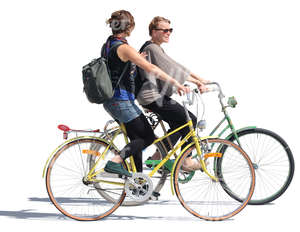 two women riding bikes side by side