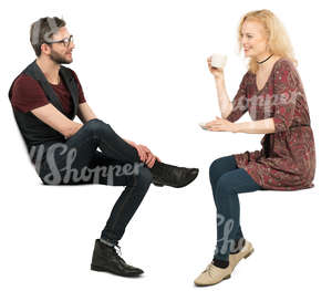 man and woman sitting in a cafe and talking