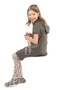 young girl sitting in a cafe and drinking lemonade