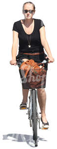 woman riding a bike in the summertime