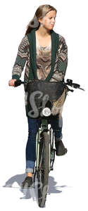 woman in a cardigan riding a bike