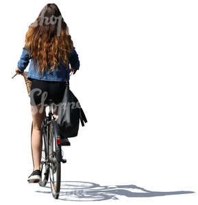 woman with long hair riding a bicycle