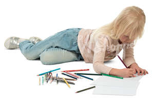 little girl lying on the floor and drawing