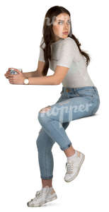 young woman siting in a cafe and drinking tea