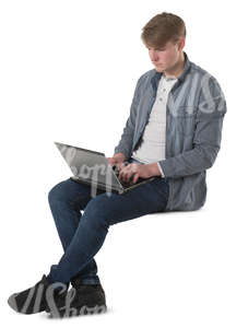 young man sitting with a laptopn on his knees