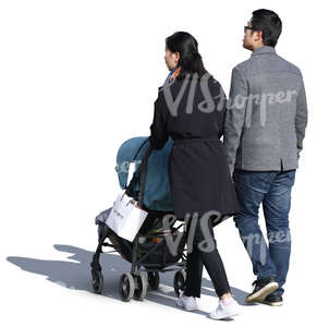 asian couple with a baby stroller walking on a sunny day