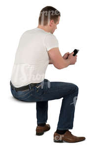 man sitting at the desk and texting