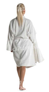 woman in a white bathrobe walking