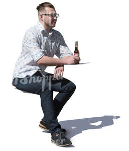 man sitting in a cafe and drinking beer