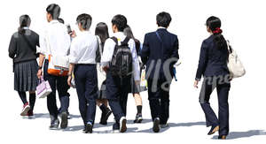 group of asian schoolchildren walking on the street