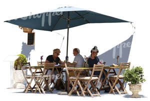 three people sitting in a street cafe