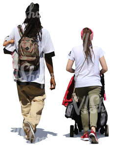 man and woman walking with a baby