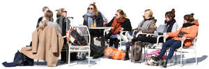 group of women sitting in a street cafe